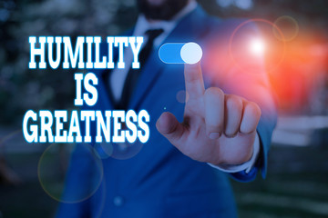 Text sign showing Humility Is Greatness. Business photo text being Humble is a Virtue not to Feel overly Superior Male human wear formal work suit presenting presentation using smart device
