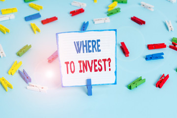 Conceptual hand writing showing Where To Invest Question. Concept meaning asking someone about place to put money into Colored clothespin papers empty reminder blue floor officepin
