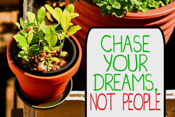 Writing note showing Chase Your Dreams Not People. Business concept for Do not follow others...