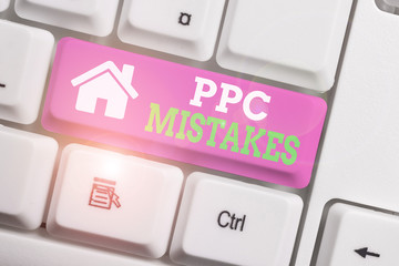 Text sign showing Ppc Mistakes. Business photo showcasing judgment that is misguided or wrong in pay per click scheme White pc keyboard with empty note paper above white background key copy space