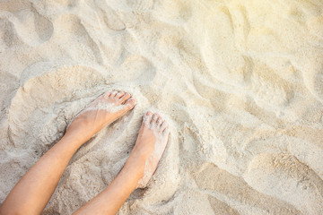 feet on the beach