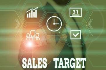 Writing note showing Sales Target. Business concept for specified amount of sales that a analysisagement sets for achieving Male wear formal work suit presenting presentation smart device