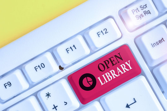 Text sign showing Open Library. Business photo showcasing online access to analysisy public domain and outofprint books White pc keyboard with empty note paper above white background key copy space