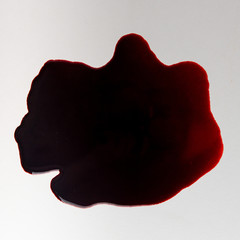 dark pool of blood on a white surface