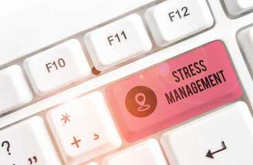 Writing note showing Stress Management. Business concept for method of limiting stress and its effects by learning ways White pc keyboard with note paper above the white background