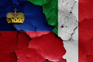 flags of Liechtenstein and Italy painted on cracked wall
