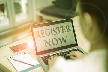 Handwriting text Register Now. Conceptual photo official list or record showing or things into web or forum woman laptop computer office supplies technological devices inside home