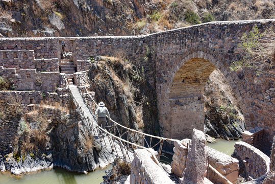 Colonial bridges spanning the river in Checacupe, Cusco, Peru