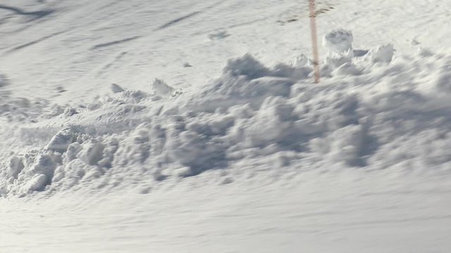 Snowboarder falling down, follow shot