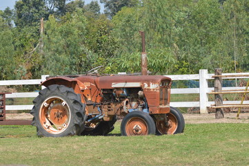 Naklejka premium old tractor in a field
