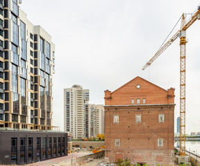 Renovation of the old 19th century house next to the new houses.