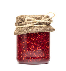  raspberry jam in a jar on a white background