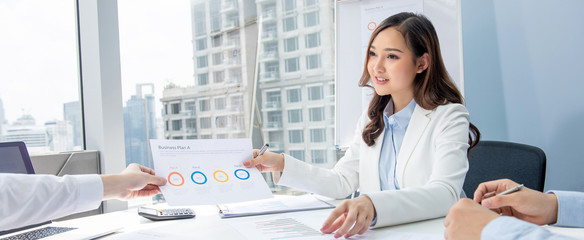 Asian businesswoman having annual meeting in office