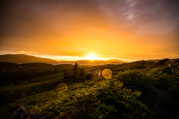 Beautiful scenic landscape of Scotland nature with beautiful evening sun set sky.