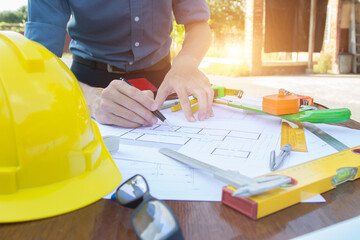 Architectural work site desk background construction project ideas concept, With drawing equipment.