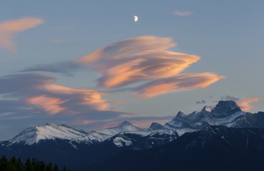 Sunset Colors, High Chinook Clouds and Snowcapped Mountain Peaks Landscape above Canmore, Alberta Foothills of Canadian Rockies early Autumn in October