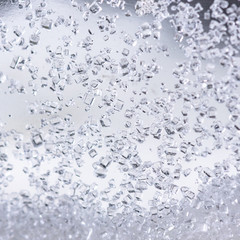 Obraz premium Close up of crystal sugar in Glass bottles on white background.
