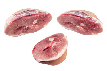 Pieces of raw meat on a white isolated background