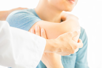 Close up of Physiotherapist working with patient in clinic