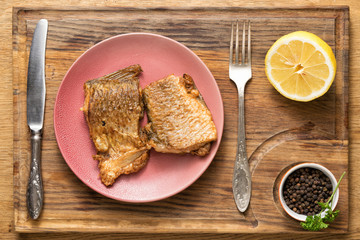 Pieces of fried fish on a served table