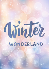 Naklejka premium Christmas card. Winter wonderland hand drawn text. Sparkling glowing lights. Background with bokeh effect.