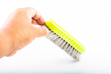 Close-up dirty clothes brush isolated on a white background