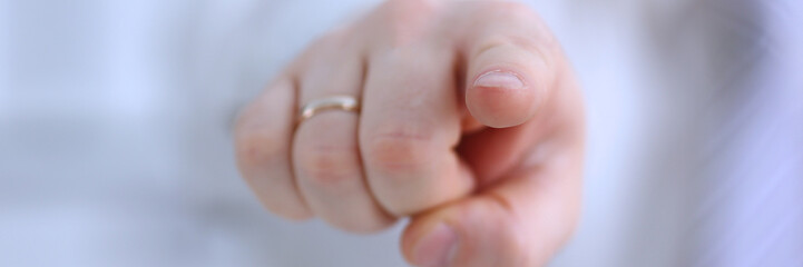 Male arm point forefinger to you or camera during conference conversation in office closeup. Suggestion illustrate offer proposition bribe demand boss advisor idea concept