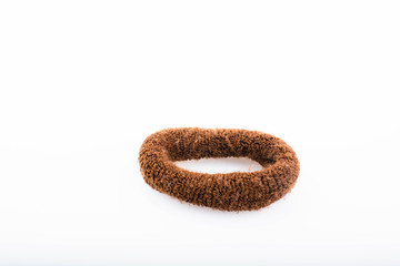 Close-up brown hair band isolated on a white background