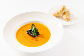 pumpkin cream soup on the white