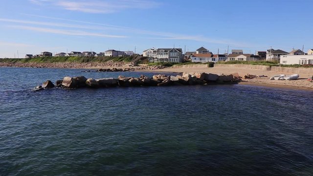 Panning shot of lifestyle seaside housing on the beach in Point Judith, Rhode Island
