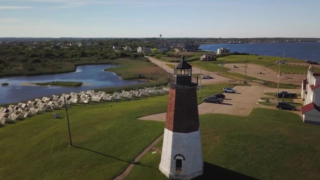 Aerial orbit of Point Judith Lighthouse powered by solar energy from solar panels