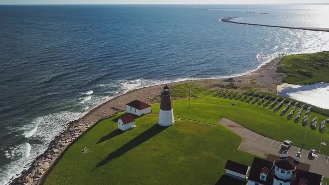 Aerial tilt up lighthouse and ocean with copy space at Point Judith