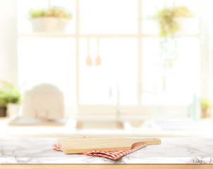 Wood table top on blurred kitchen background