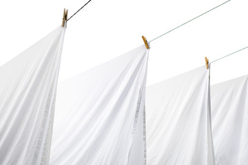 sheets hang on a hanger on clothespins. clothes to dry. background isolated. place for mockup