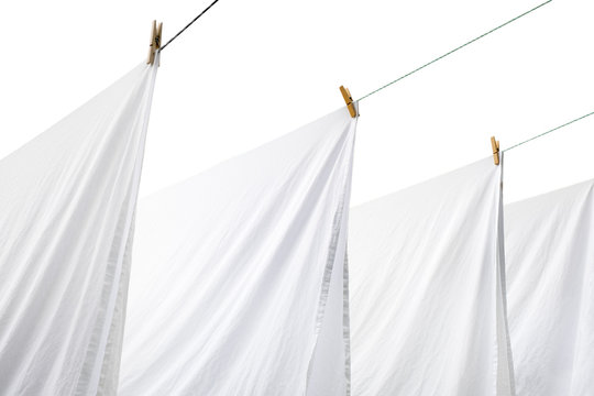sheets hang on a hanger on clothespins. clothes to dry. background isolated. place for mockup