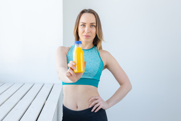 Healthy lifestyle, diet and vitamins - fitness woman with juice.