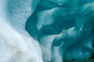 Fototapeta premium Melting clean blue ice in glacier ice cave.