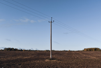 A single electric post on a field