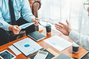 Business team meeting Strategy Planning with new startup project plan Finance and Economy Graph with laptop successful teamwork