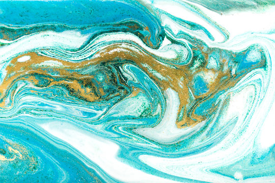 Green and gold ripple of agate background. Golden powder marble texture.