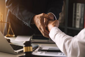 business people and lawyers discussing contract papers sitting at the table. Concepts of law,...