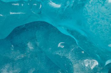 Clerar blue glacier ice texture.