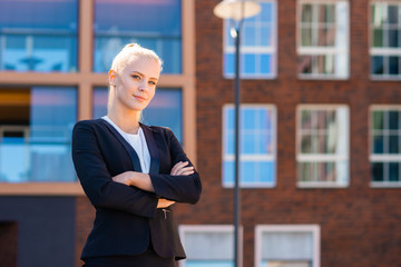 Outdoor photo of young and attractive businesswoman, retailer or student. Woman in casual wear. Real estate, business and education.