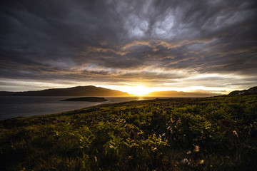 Naklejka na ściany i meble Beautiful scenic landscape of Scotland nature with beautiful evening sun set sky.