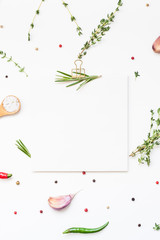 Blank notepad pages with greens herbs and spices