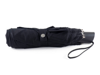 Black rolled umbrella of compact size. Umbrella for protection from rain in autumn