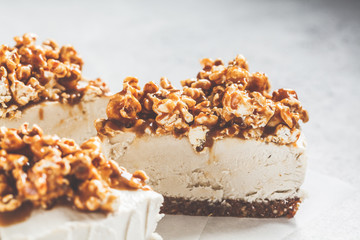 Raw vegan cashew cheesecake with caramel popcorn. Raw vegan dessert concept.