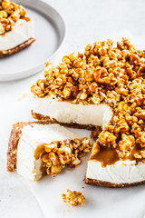 Raw vegan cashew cheesecake with caramel popcorn. Raw vegan dessert concept.