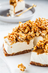 Raw vegan cashew cheesecake with caramel popcorn. Raw vegan dessert concept.