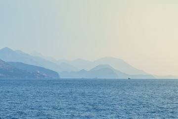 Budva Riviera in Montenegro, view from the sea on a summer day